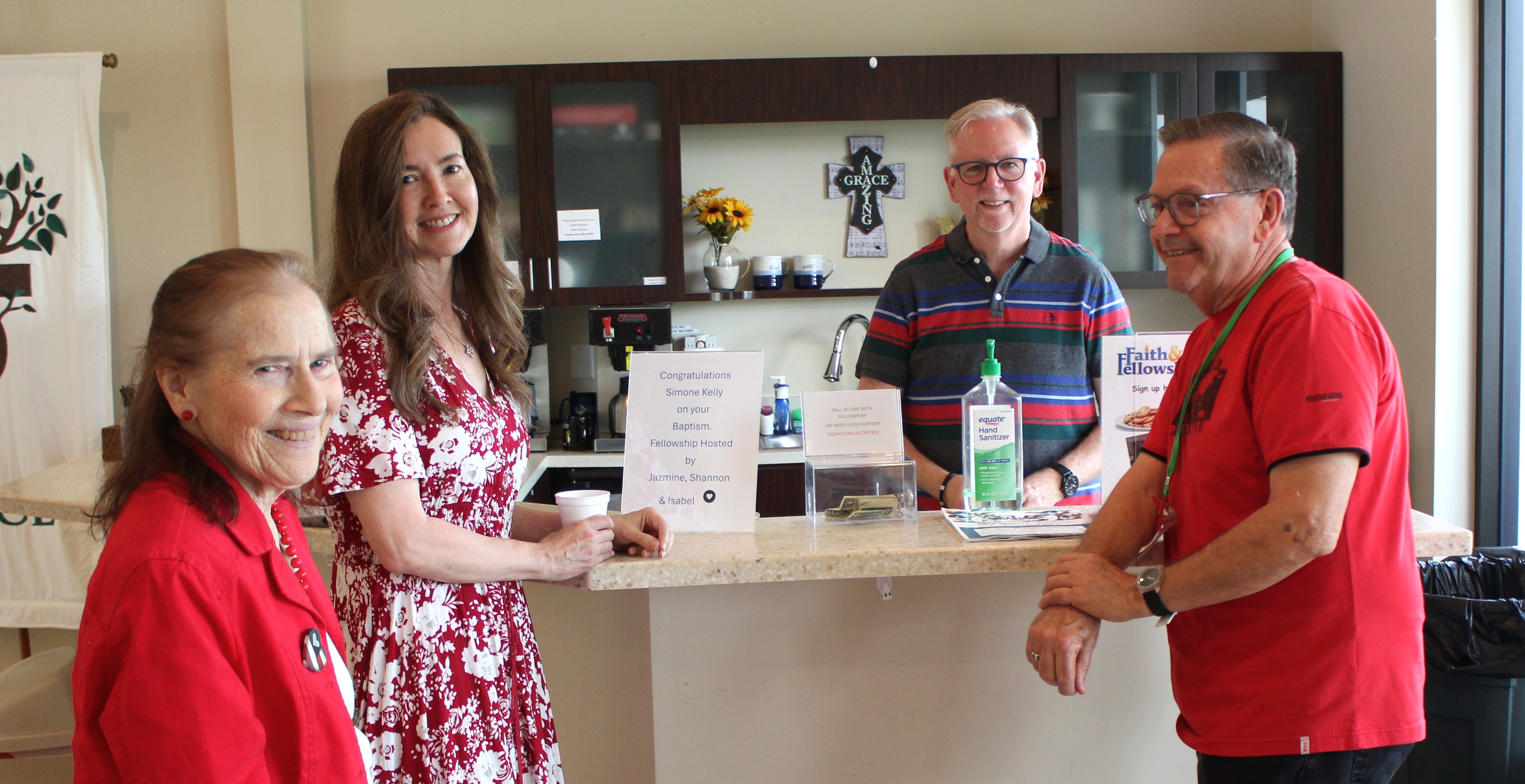 Members greeting one another at the welcome table